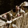 Members of the Huinchiri community rebuild an Incan hanging bridge, known as the Q’eswachaka bridge, using traditional weaving techniques in Canas, Peru.