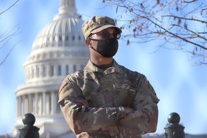 Members of the National Guard secure the perimeter around the Capitol in Washington DC