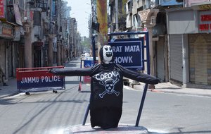 People of Jammu paint effigy to spread message about awareness about coronavirus pandemic during COVID-19 induced curfew at Bharat Mata chowk in Jammu, India, 30 May 2021.