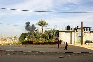 Smoke rises after an Israeli air strike in Rafah in the southern Gaza Strip on November 21, 2012. The Israeli military said it attacked about 100 targets in the coastal enclave of the Gaza Strip, during the night, using aircraft, warships and artillery.Photo by Ahmed Deeb / WN