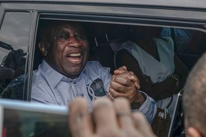 Former Ivorian president Laurent Gbagbo arrives at the international airport, in Abidjan, Ivory Coast, Thursday, June 17, 2021