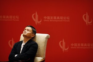 Jack Ma looks up during a panel discussion held as part of the China Development Forum at the Diaoyutai State Guesthouse in Beijing