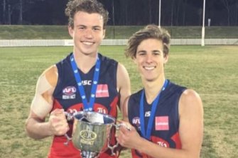 Giants pair Kieren Briggs and James Peatling celebrating a 2017 premiership with the Pennant Hills Football Club.