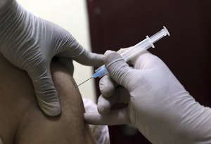 A man receives the Sinopharm COVID-19 vaccine at a vaccination center, in Kabul, Afghanistan, Wednesday, June 16, 2021.