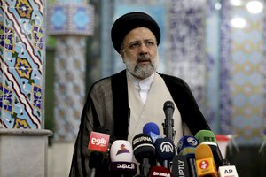 Ebrahim Raisi, a candidate in Iran's presidential elections speaks to the media after casting his vote at a polling station in Tehran, Iran Friday, June 18, 2021