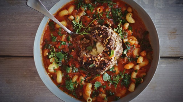 Chunky minestrone with mozzarella stuffed meatball.