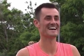 Bernard Tomic got his Wimbledon qualifying campaign off to a winning start but couldn't resist some trademark theatrics in his post-match interview.