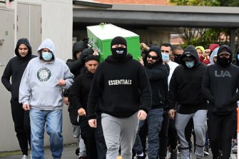 Mourners carry the coffin of Bilal Hamze into the Lakemba Mosque during his funeral service on Wednesday. 