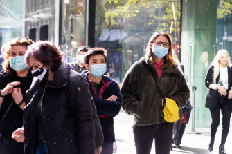 People are wearing masks shopping in Pitt Street.