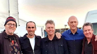 Refugee Mostafa ‘Moz’ Azimitabar, second from left, with Midnight Oil members Jim Moginie, Martin Rotsey, Peter Garrett and Rob Hirst. 