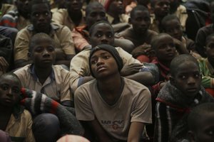 A group of schoolboys gather following their release after they were kidnapped last week, Friday Dec. 18, 2020 in Katsina, Nigeria