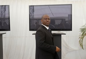 Ivory Coast Prime Minister Guillaume Soro walks before speaking to media