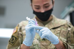 The Wyoming Army National Guard’s Medical Detachment administers the new Moderna vaccine to select members at the Raper Armory, Wyoming Army National Guard, Cheyenne, Wyo., Jan. 6, 2021