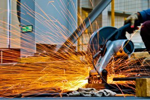 Cut-off saw cutting metal with sparks