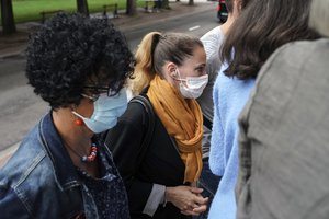 Valerie Bacot, center, arrives with relatives at the Chalon-sur-Saone courthouse, central France, Thursday, June 24, 2021