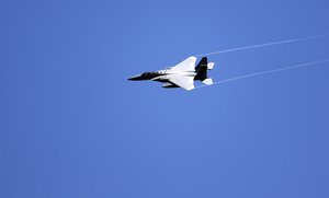 A U.S. military fighter jet flies over Gillette Stadium before an NFL football game between the New England Patriots and the New York Jets, Sunday, Sept. 22, 2019, in Foxborough, Mass.