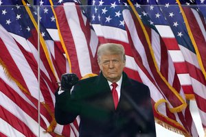 FILE - In this Jan. 6, 2021, file photo, then-President Donald Trump gestures as he arrives to speak at a rally in Washington.