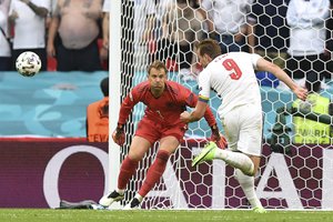 England's Harry Kane receives the ball before heading home his side's second goal during the Euro 2020 soccer championship round of 16 match between England and Germany at Wembley Stadium in England, Tuesday June 29, 2021