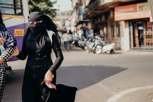 Woman in-black abaya with a friend