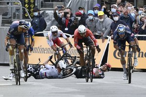 Slovakia's Peter Sagan, center left, crashes with Australia's Caleb Ewan, center right, during the sprint towards the finish line of the third stage of the Tour de France cycling race over 182.9 kilometers (113.65 miles) with start in Lorient and finish in Pontivy, France, Monday, June 28, 2021