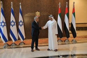 In this photo made available by the Israeli Government Press Office, Israeli Foreign Minister Yair Lapid shakes hands with United Arab Emirates Foreign Minister Sheikh Abdullah bin Zayed al-Nahyan in Abu Dhabi, United Arab Emirates, Tuesday, June 29, 2021