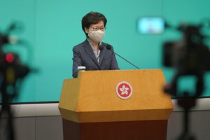 Hong Kong Chief Executive Carrie Lam listens to reporters questions during a press conference in Hong Kong, Tuesday, June 9, 2020.