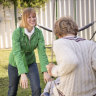 Briana Blackett plays with her two sons, who have autism, in their backyard.