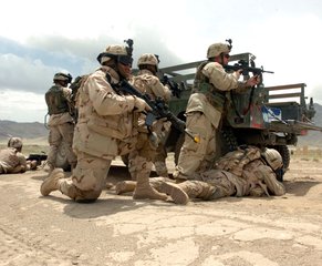 Soldiers from Company A, 3rd Battalion, 141st Infantry Regiment, Texas Army National Guard, squeeze in some training time near Bagram, Afghanistan.     This photo appeared on www.army.mil.