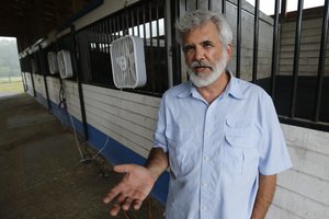 Dr. Robert Malone gestures as he stands in his barn on his horse farm Wednesday July 22, 2020, in Madison