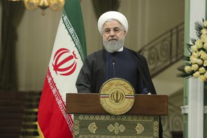 In this photo released by official website of the office of the Iranian Presidency, President Hassan Rouhani attends a joint press briefing with his Iraqi counterpart Barham Salih after their meeting at the Saadabad Palace in Tehran, Iran, Saturday, Nov. 17, 2018.