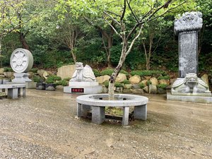 Statues and circular sitting areas on the way to Haedong Yonggung Temple in Busan, South Korea.