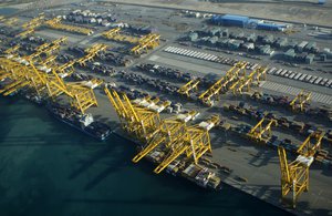 FILE - In this Sunday, Jan. 3, 2010 file photo, container ships dock at the Dubai Port in the Jebel Ali Free Zone about 40 kilometers (25 miles) south of Dubai, United Arab Emirates