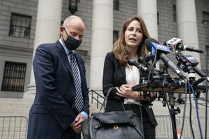 Michael Avenatti, left, stands with his lawyer Danya Perry, right, during a news conference after he departs a scheduled sentencing at Manhattan federal court, Thursday, July 8, 2021, in New York