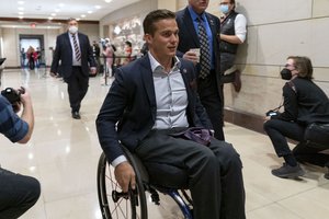 Rep. Madison Cawthorn, R-N.C., arrives as the House Republican Conference meets to elect a new chairman to replace Rep. Liz Cheney, R-Wyo., who was ousted from the GOP leadership for her criticism of former President Donald Trump, at the Capitol in Washington, Friday, May 14, 2021