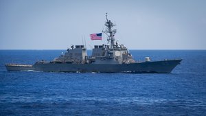 The Arleigh Burke-class guided-missile destroyer USS Benfold (DDG 65) sails in formation during exercise Malabar 2018