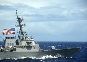 The guided-missile destroyer USS Benfold (DDG 65) flies the battle ensign during maneuvers off the coast of Kauai as part of maritime exercise Koa Kai 12-2