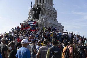 Anti-government protesters gather at the Maximo Gomez monument in Havana, Cuba, Sunday, July 11, 2021