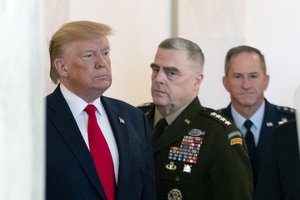 President Donald Trump arrives to address the nation from the White House on the ballistic missile strike that Iran launched against Iraqi air bases housing U.S. troops, Wednesday, Jan. 8, 2020, in Washington, accompanied by Joint Chiefs Chairman Gen. Mark Milley, center, and U.S. Air Force Chief of Staff Gen. David L. Goldfein. (AP Photo/Alex Brandon)