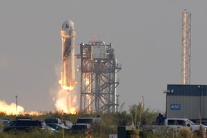 Blue Origin's New Shepard rocket launches carrying passengers Jeff Bezos, founder of Amazon and space tourism company Blue Origin, brother Mark Bezos, Oliver Daemen and Wally Funk, from its spaceport near Van Horn, Texas, Tuesday, July 20, 2021.