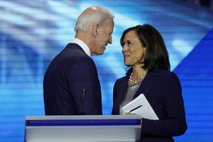 former Vice President Joe Biden, left, and Sen. Kamala Harris, D-Calif. shake hands at Texas Southern University in Houston