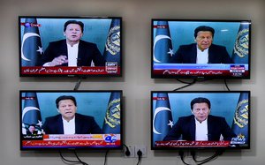 File - Various Pakistani news channels broadcast a live address to the nation by Pakistan's Prime Minister Imran Khan, at the office of The Associated Press, in Islamabad, Pakistan Thursday, March 4, 2021.