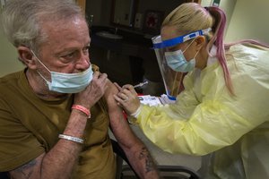 Resident Walter Sooy receives the COVID-19 vaccination at the New Jersey Veterans Memorial Home at Vineland, Vineland, N.J., Jan.1, 2021