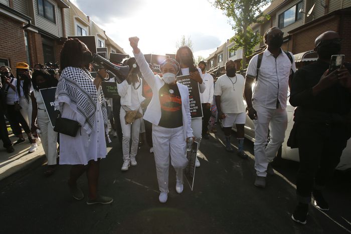 Pam Africa leads march