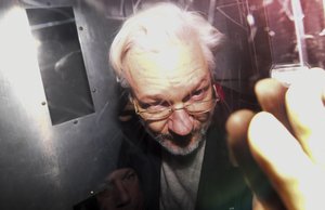 File - Wikileaks founder Julian Assange leaves in a prison van after appearing at Westminster Magistrates Court, for an administrative hearing in London, Monday, Jan. 13, 2020.