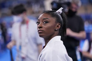 Simone Biles, of the United States, waits for her turn to perform during the artistic gymnastics women's final at the 2020 Summer Olympics, Tuesday, July 27, 2021, in Tokyo