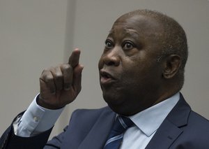 Laurent Gbagbo enters the courtroom of the International Criminal Court  in The Hague, Netherlands