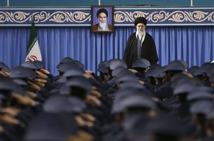 In this picture released by official website of the office of the Iranian supreme leader, Supreme Leader Ayatollah Ali Khamenei stands as army air force and air defense staff salute at the start of their meeting in Tehran, Iran, Thursday, Feb. 8, 2018.