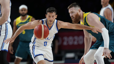 Australia’s Aron Baynes (right) vies with Italy’s Marco Spissu for the ball.