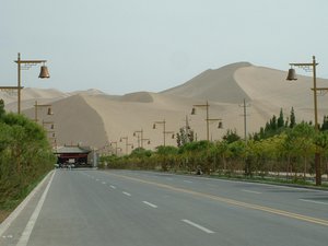 File - The Singing Sand Dunes on the eastern edge of the Kumtag Desert near Dunhuang in Northwestern Gansu Province, Western China.