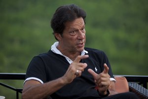 Pakistan's opposition leader Imran Khan speaks to the Associated Press at his residence in Islamabad, Pakistan, Monday, Sept. 25, 2017.